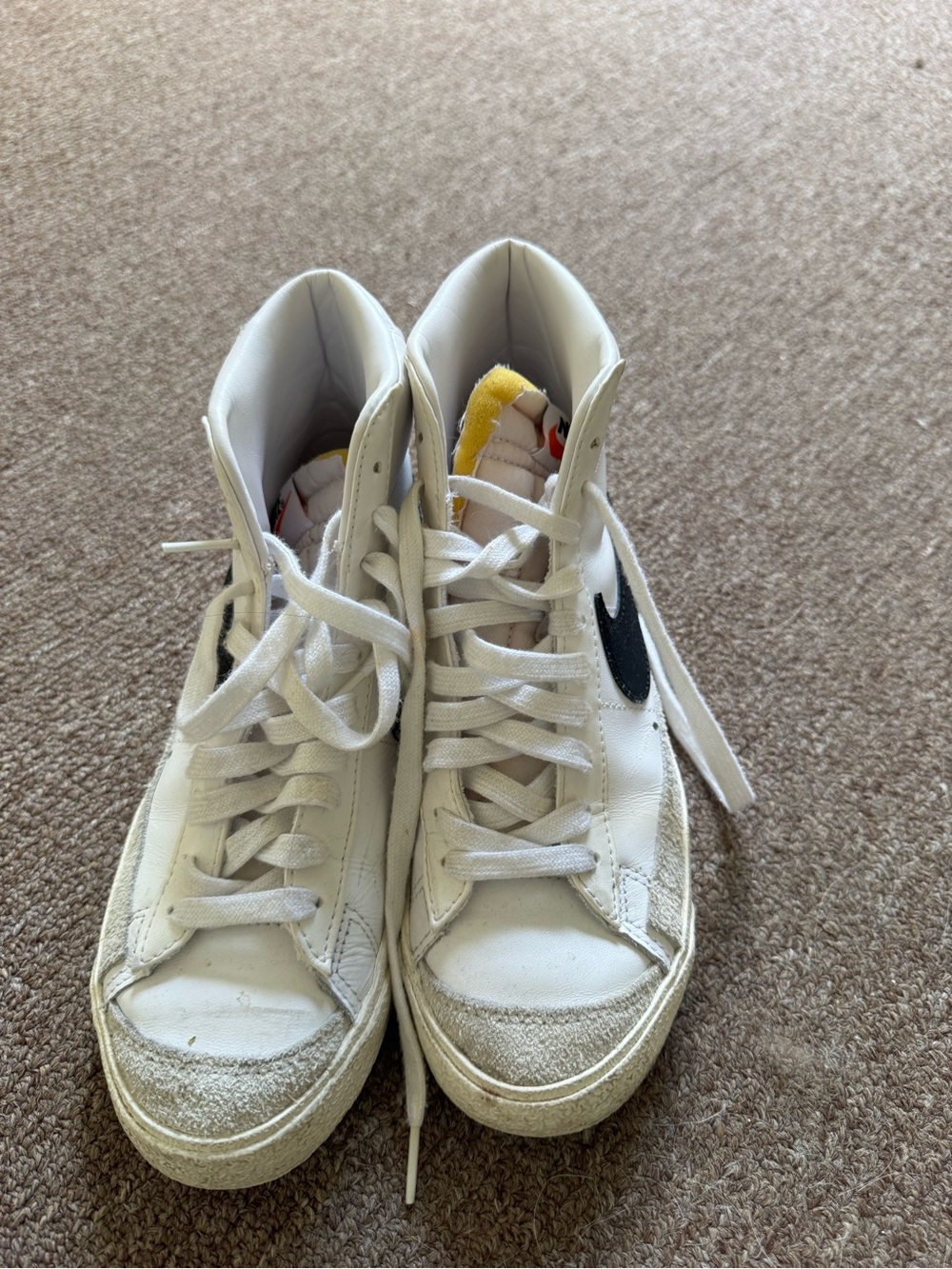 Nike White High-Top Sneakers with Black Swoosh and Yellow Tongue Detail